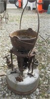 Antique heater with cast iron pot.