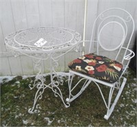 Metal outdoor rocking chair and table.