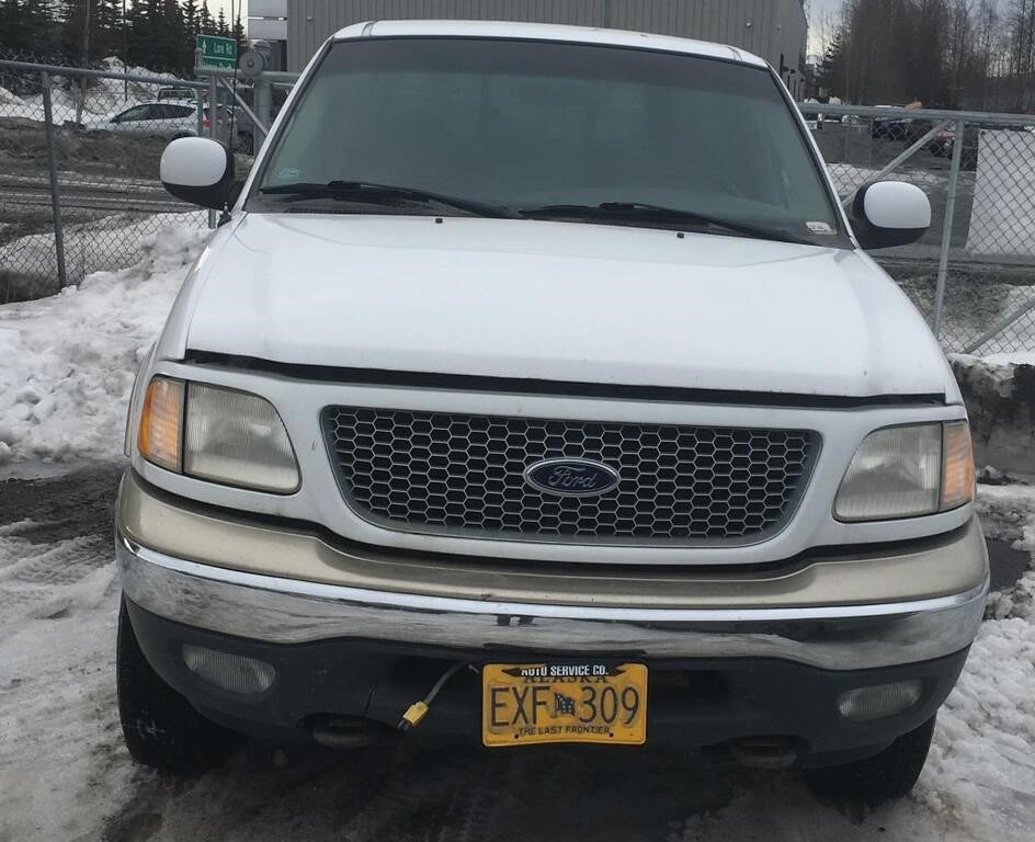 1999 Ford F150 with 4WD. Single cab with a long bd