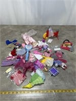 Assortment of Barbie clothes and accessories