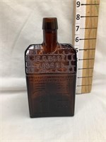 E.G. Booz Amber “Cabin” Embossed Whiskey Bottle,