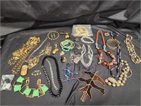 Costume jewelry.   Necklaces,  pins, bracelets