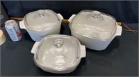 White cassarol dishes/lids marked Pyrex