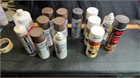 Mostly full cans of spray paint