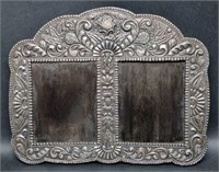 LARGE REPOUSSE SILVERED DOUBLE PICTURE FRAME