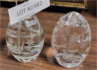 2 EGG-SHAPED STARLIGHT-THEMED GLASS PAPERWEIGHTS