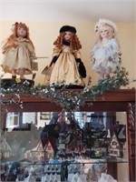 3X DOLLS ON TOP OF GLASS CABNET