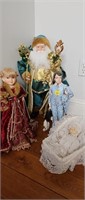 Santa, Chna Dolls, and boy statue