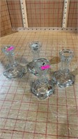 Four clear glass candleholders