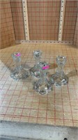 Four clear glass candle holders