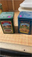 Two Nestle tins