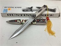 NIB Hunting knife with tassel and sheath.