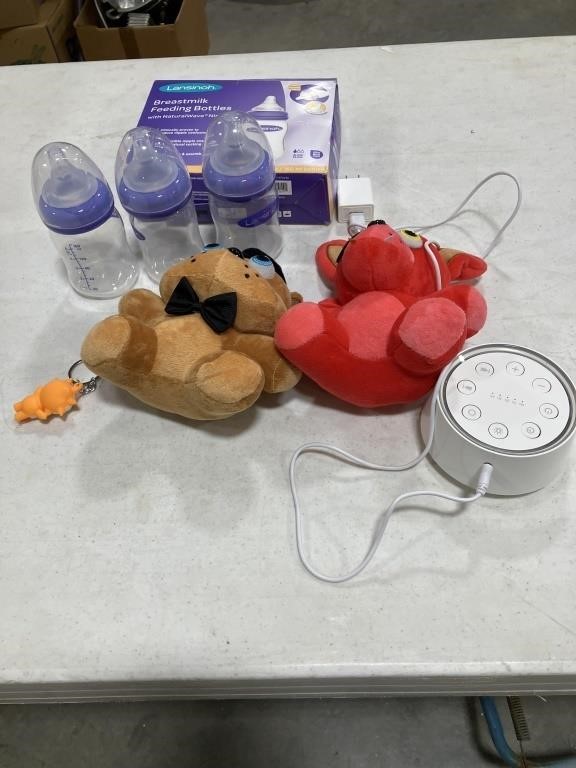 Breast-feeding, bottles, two stuffed animals a