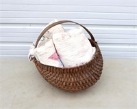 ANTIQUE BASKET FULL OF QUILTS