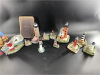 Collection of light house figurines including 1985