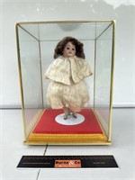 Antique Doll in Glass Display Cabinet. Cabinet