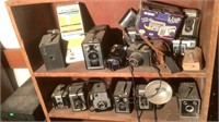 (2) Shelfs Of Vintage Cameras & Accessories