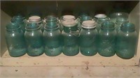 Shelf Of Antique Blue Mason Jars