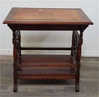 Leather top carved wood parlor table