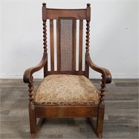 Antique oak and cane-back rocking chair with