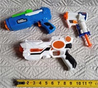 Toy nerf guns and a laser tag gun makes sound.