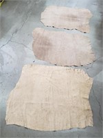 Bundle of three leather hides