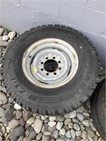 2 STUDDED TIRES, SIZE 235/85R16