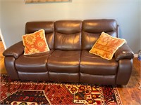 Leather couch with electric end cliners