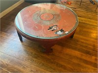 Round wooden table with glasss top