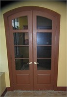 Pair of elegant 8 pane curved top hard wood doors