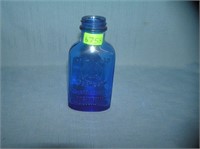 Antique blue glass milk of magnesia bottle