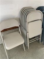 9 beige metal folding chairs