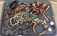 Tray of wood beads and leather jewelry