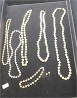 Pearl like necklaces, bracelet and earrings   1912