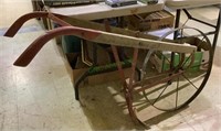 Vintage wooden handle metal wheel garden tiller