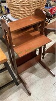 Small laminate wood child’s writing desk with