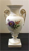 Beautiful porcelain urn with hand painted flower.
