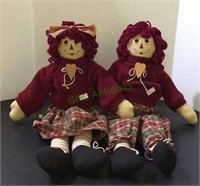 Raggedy Ann-like plush dolls with sweaters and