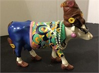 Cow parade collector cow figurine measuring 5