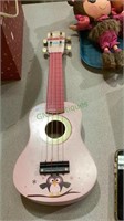 Child’s four string toy guitar 833