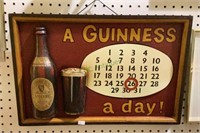 Wood and metal Guinness sign which serves as a