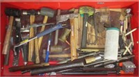 Contents of drawer that includes hammers, nail