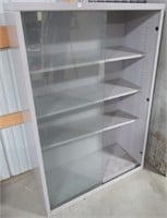 Steel display case with glass sliding doors.