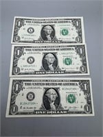 Lot of three Star Notes one-dollar bills