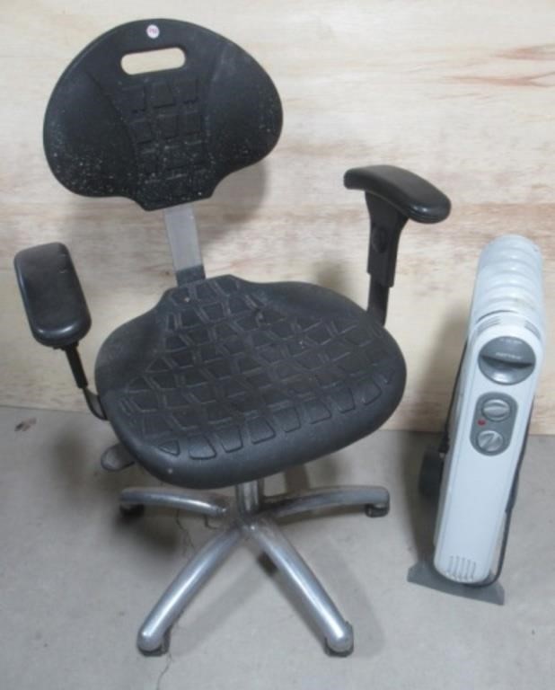 Patton electric heater with rolling office chair.
