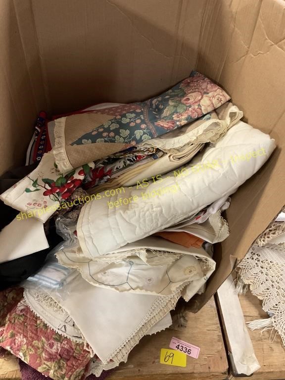 Box with assorted table linens