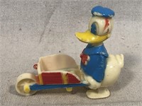 Donald Duck with wheel barrow