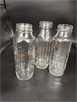 Vintage glass evenflo baby bottles
