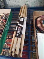 3 pairs of what I believe are used drumsticks