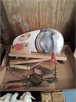 Flat of kitchen items including a meat slicer